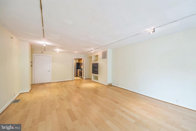1520 16th St NW Unit 101, Washington, DC 20036 - spare room featuring light wood finished floors