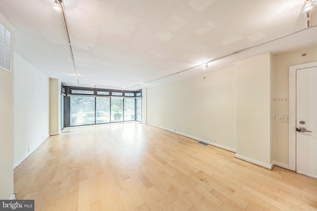 1520 16th St NW Unit 101, Washington, DC 20036 - unfurnished room with floor to ceiling windows and light wood-style flooring