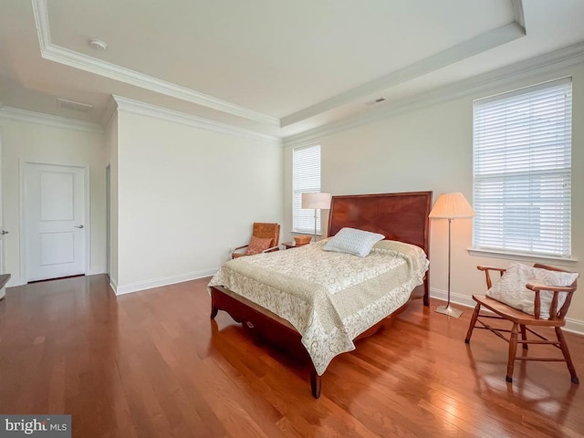 245 Carson Way, Yardley, PA 19067 - bedroom featuring a raised ceiling, multiple windows, wood finished floors, and ornamental molding