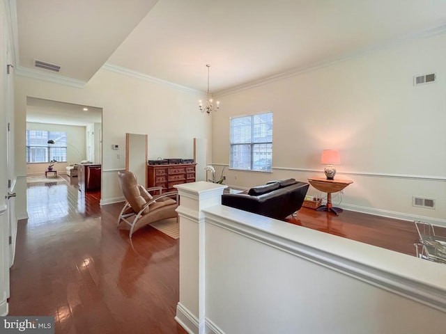 245 Carson Way, Yardley, PA 19067 - living area with dark wood-style floors, crown molding, and a chandelier