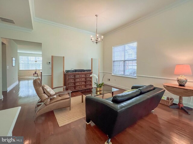 245 Carson Way, Yardley, PA 19067 - living area with wood finished floors, ornamental molding, a chandelier, and baseboards