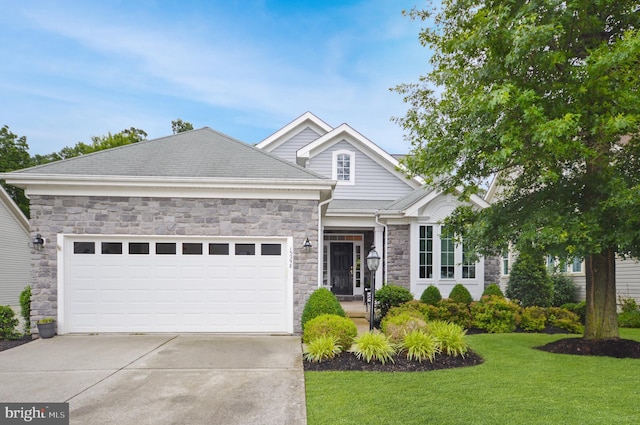 13298 Fieldstone Way, Gainesville, VA 20155 - view of front of home featuring a garage, driveway, stone siding, and a front yard