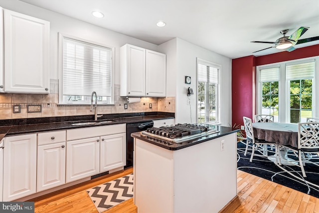 13298 Fieldstone Way, Gainesville, VA 20155 - kitchen featuring stainless steel gas cooktop, dishwasher, light wood finished floors, plenty of natural light, and recessed lighting