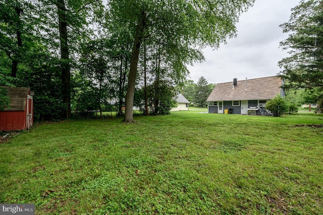 1075 Fireside Ave, Trenton, NJ 08618 - view of grassy yard with a storage shed