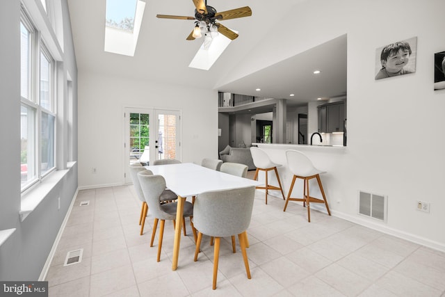 818 Northridge Way, Severna Park, MD 21146 - dining space with high vaulted ceiling, a skylight, ceiling fan, light tile patterned floors, and french doors