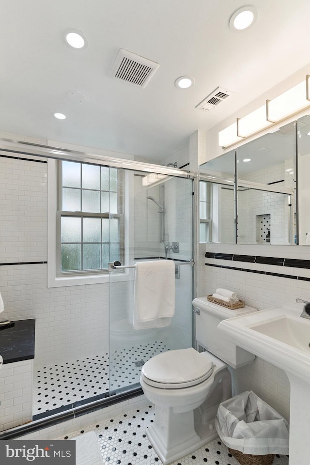 2625 3rd St NE Unit 306, Washington, DC 20002 - full bath with a shower stall, tile walls, and recessed lighting