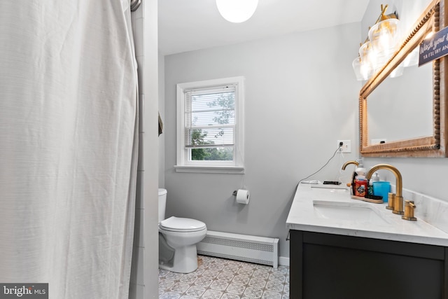 101 Horners Rd, Carlisle, PA 17015 - bathroom with a baseboard heating unit, double vanity, toilet, baseboards, and tile patterned floors