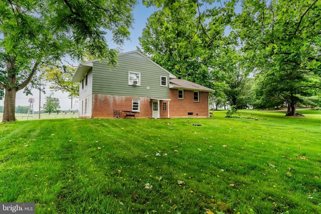 101 Horners Rd, Carlisle, PA 17015 - back of house with brick siding and a lawn
