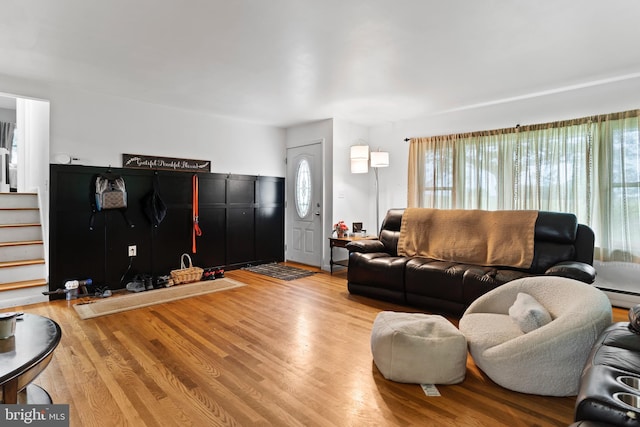 101 Horners Rd, Carlisle, PA 17015 - living room with a baseboard radiator, light wood-type flooring, and stairway