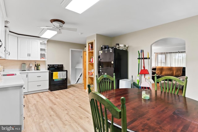 101 Horners Rd, Carlisle, PA 17015 - dining space with light wood-style flooring, arched walkways, and a ceiling fan