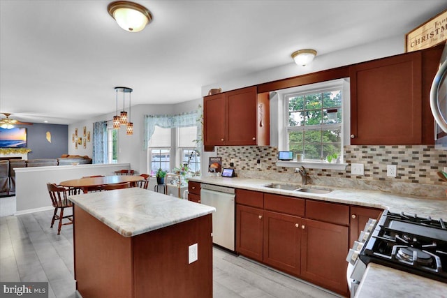 509 W Reeser St, Leesport, PA 19533 - kitchen featuring white dishwasher, healthy amount of natural light, and decorative backsplash