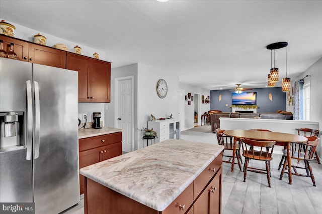 509 W Reeser St, Leesport, PA 19533 - kitchen with stainless steel refrigerator with ice dispenser, ceiling fan, open floor plan, a kitchen island, and pendant lighting