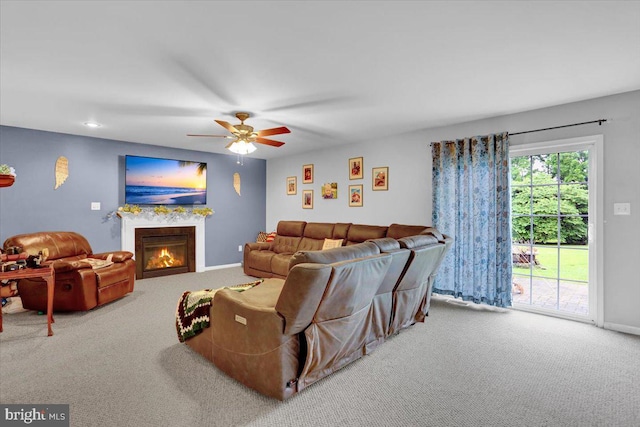 509 W Reeser St, Leesport, PA 19533 - living room with carpet, ceiling fan, and a warm lit fireplace