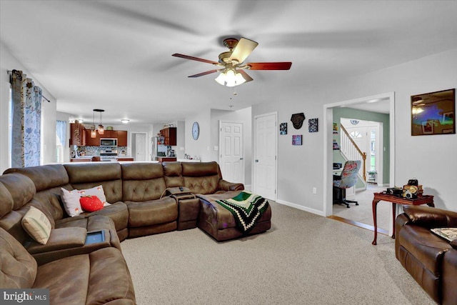 509 W Reeser St, Leesport, PA 19533 - carpeted living room featuring ceiling fan and stairway