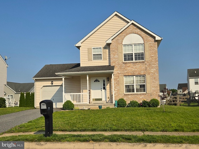 79 Liborio Ln, Smyrna, DE 19977 - traditional-style house featuring brick siding, a garage, asphalt driveway, and covered porch