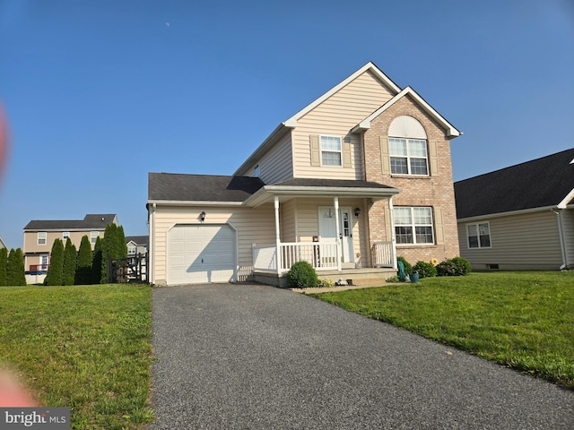 79 Liborio Ln, Smyrna, DE 19977 - traditional home featuring a porch, a garage, asphalt driveway, and a front lawn