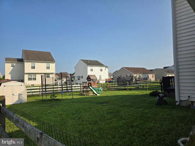 79 Liborio Ln, Smyrna, DE 19977 - fenced backyard featuring a residential view, a playground, and a storage shed