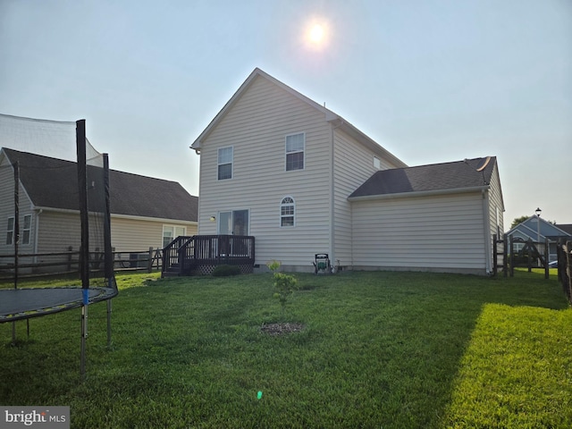 79 Liborio Ln, Smyrna, DE 19977 - back of property with a trampoline, a wooden deck, and a yard