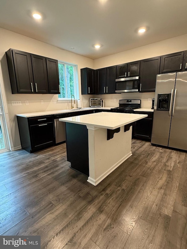 11 Autumn Ln, Egg Harbor Twp, NJ 08234 - kitchen featuring stainless steel appliances, dark cabinets, light countertops, a kitchen island, and dark wood finished floors