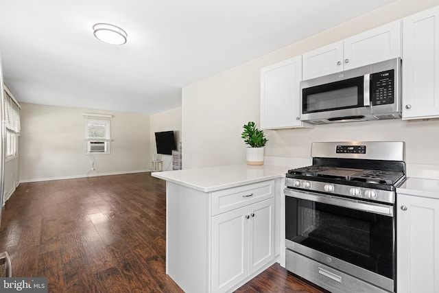245 Spout Spring Ave, Lumberton, NJ 08048 - kitchen featuring appliances with stainless steel finishes, a peninsula, light countertops, open floor plan, and white cabinetry