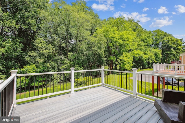 9417 Reach Rd, Potomac, MD 20854 - wooden deck featuring a lawn