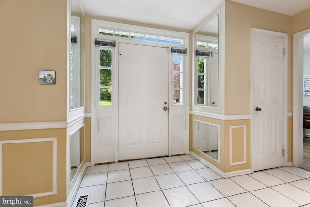 9417 Reach Rd, Potomac, MD 20854 - foyer with healthy amount of natural light and light tile patterned floors
