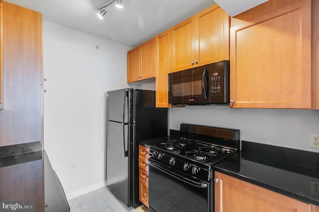851 N Glebe Rd Unit 1413, Arlington, VA 22203 - kitchen featuring black appliances, dark countertops, light tile patterned floors, and track lighting