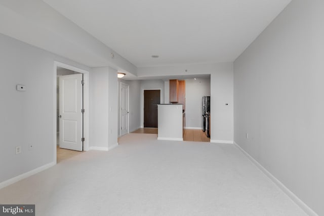 851 N Glebe Rd Unit 1413, Arlington, VA 22203 - unfurnished living room featuring light colored carpet and baseboards