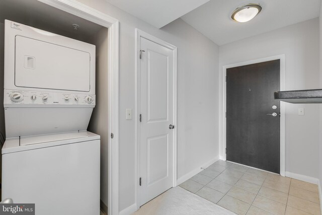 851 N Glebe Rd Unit 1413, Arlington, VA 22203 - washroom featuring stacked washing machine and dryer and light tile patterned flooring