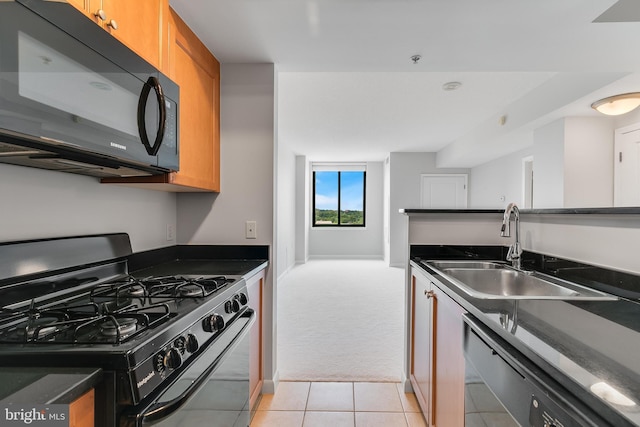 851 N Glebe Rd Unit 1413, Arlington, VA 22203 - kitchen featuring stainless steel range with gas cooktop, black microwave, dishwashing machine, dark countertops, and brown cabinetry