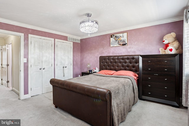 2203 Pyle St, Wilmington, DE 19805 - bedroom featuring light colored carpet, multiple closets, ornamental molding, and a chandelier