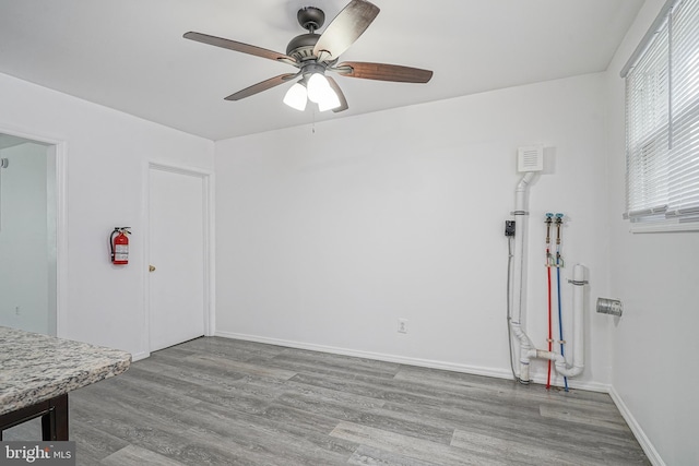 1549 S 8th St, Camden, NJ 08104 - empty room featuring wood finished floors, a ceiling fan, and baseboards