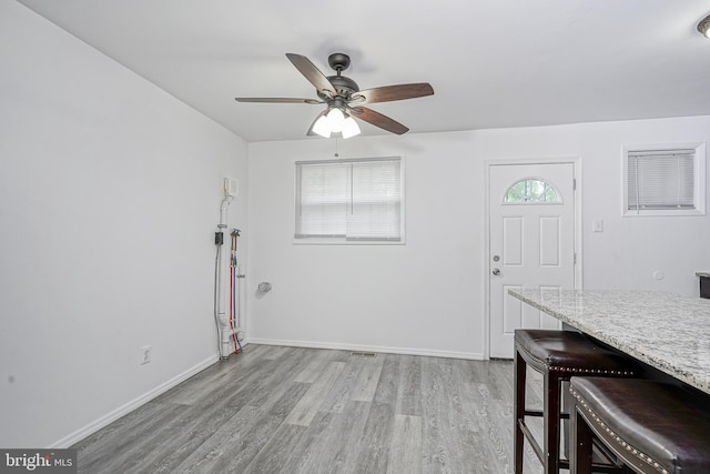 1549 S 8th St, Camden, NJ 08104 - living room with light wood finished floors, ceiling fan, and baseboards