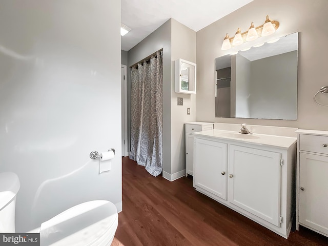 17 Butternut Ln, Hanover, PA 17331 - bathroom with toilet, wood finished floors, vanity, baseboards, and a shower with shower curtain