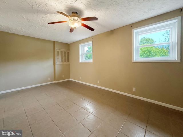 17 Butternut Ln, Hanover, PA 17331 - empty room featuring ceiling fan, tile patterned flooring, baseboards, and a textured ceiling
