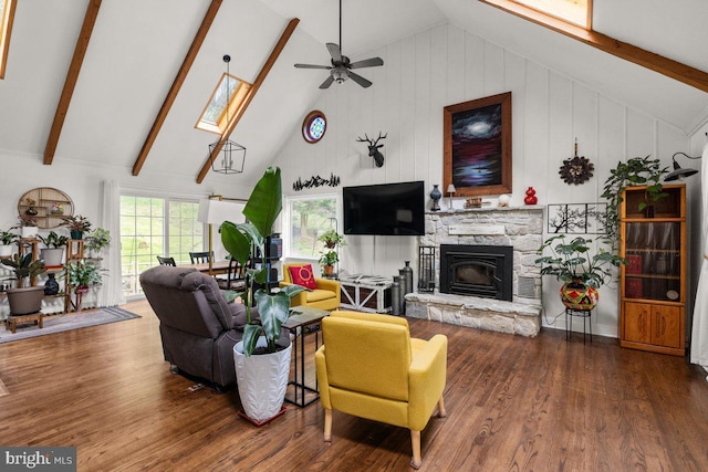 206 English Muffin Ct, Berkeley Springs, WV 25411 - living area with wood finished floors, a fireplace, a skylight, ceiling fan, and high vaulted ceiling