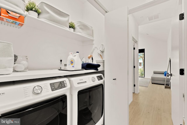 4020 35th St Unit B, Mount Rainier, MD 20712 - laundry area with washer and dryer and light wood-style floors