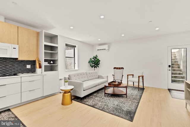 4020 35th St Unit B, Mount Rainier, MD 20712 - living area featuring an AC wall unit, light wood-style flooring, recessed lighting, and stairway