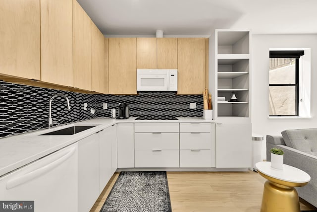 4020 35th St Unit B, Mount Rainier, MD 20712 - kitchen with white appliances, tasteful backsplash, light brown cabinets, and light wood-style flooring