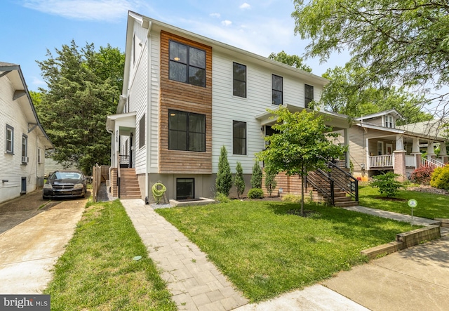 4020 35th St Unit B, Mount Rainier, MD 20712 - view of front facade featuring stairs, concrete driveway, and a front yard