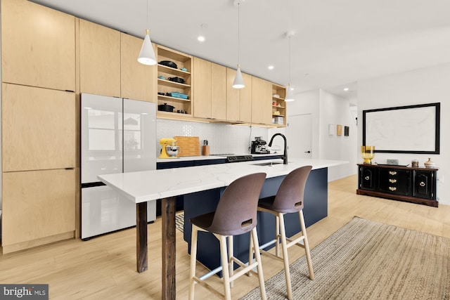 4020 35th St Unit B, Mount Rainier, MD 20712 - kitchen featuring open shelves, light brown cabinetry, freestanding refrigerator, light wood finished floors, and modern cabinets
