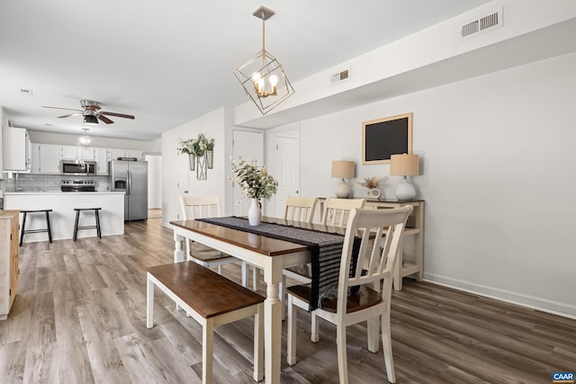 366 Saint Ivy Ave, Troy, VA 22974 - dining room featuring light wood-style flooring, a chandelier, and a ceiling fan