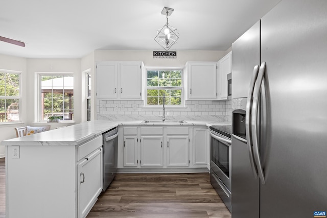 366 Saint Ivy Ave, Troy, VA 22974 - kitchen featuring appliances with stainless steel finishes, a peninsula, white cabinets, and healthy amount of natural light