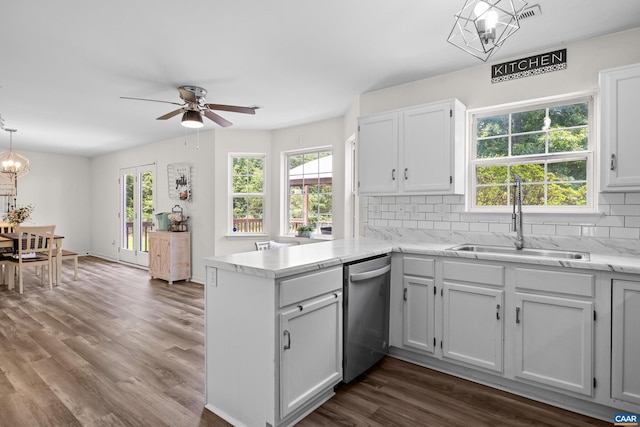 366 Saint Ivy Ave, Troy, VA 22974 - kitchen with stainless steel dishwasher, a peninsula, a chandelier, tasteful backsplash, and a ceiling fan
