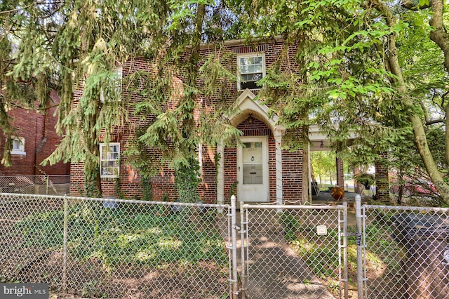 1220 N 14th St, Harrisburg, PA 17103 - view of front of house featuring brick siding, a gate, and a fenced front yard