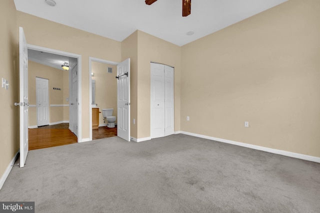 2495 Amber Orchard Ct E Unit 101, Odenton, MD 21113 - unfurnished bedroom featuring carpet, baseboards, a closet, ensuite bath, and a ceiling fan