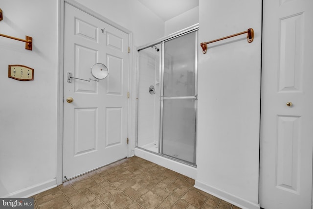 2495 Amber Orchard Ct E Unit 101, Odenton, MD 21113 - full bathroom featuring a shower stall and baseboards