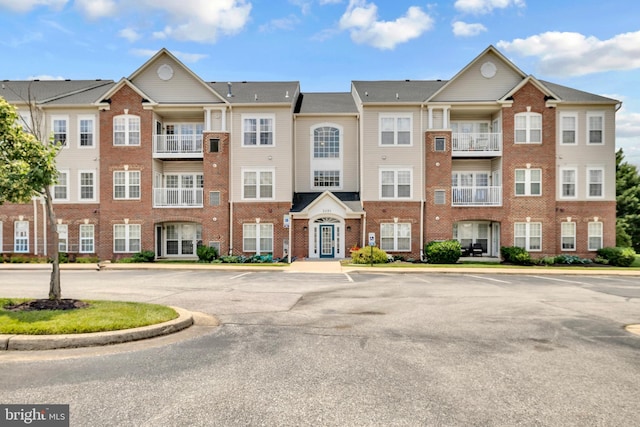 2495 Amber Orchard Ct E Unit 101, Odenton, MD 21113 - view of building exterior featuring uncovered parking