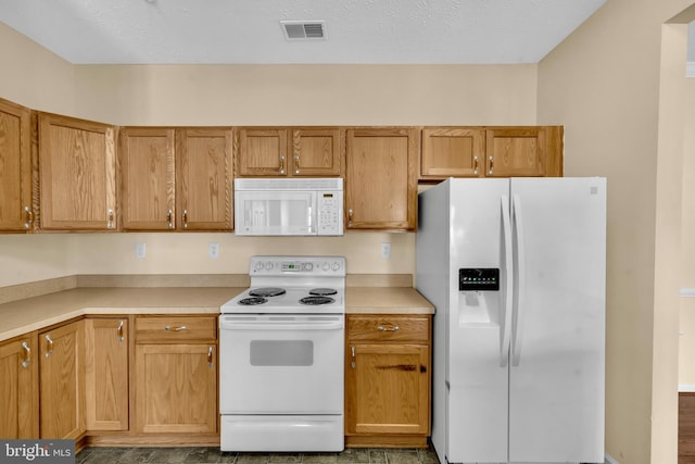 2495 Amber Orchard Ct E Unit 101, Odenton, MD 21113 - kitchen with white appliances, light countertops, and brown cabinets