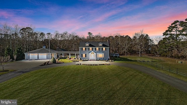 2029 E Buckshutem Rd, Millville, NJ 08332 - view of front of property featuring asphalt driveway, a garage, a porch, and view of wooded area